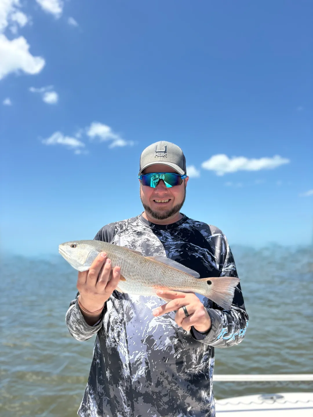 Fisherman displaying his catch proudly