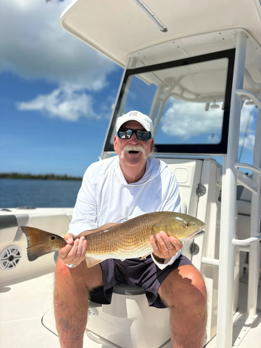 Fisherman proudly displaying catch