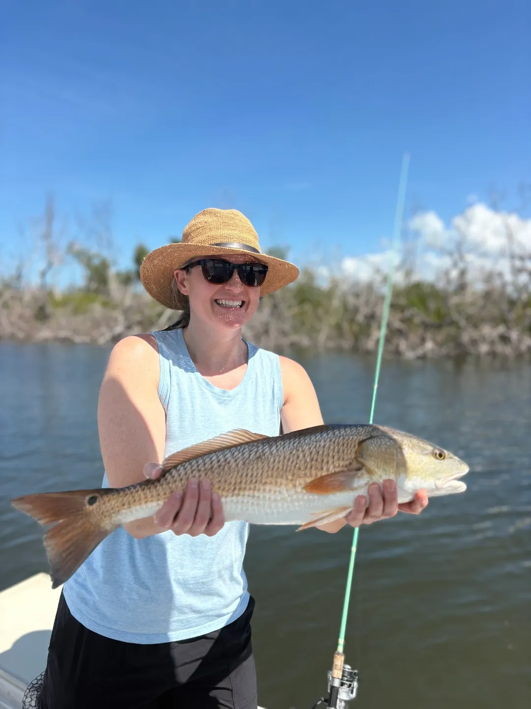 Fisherwoman displaying her catch proudly