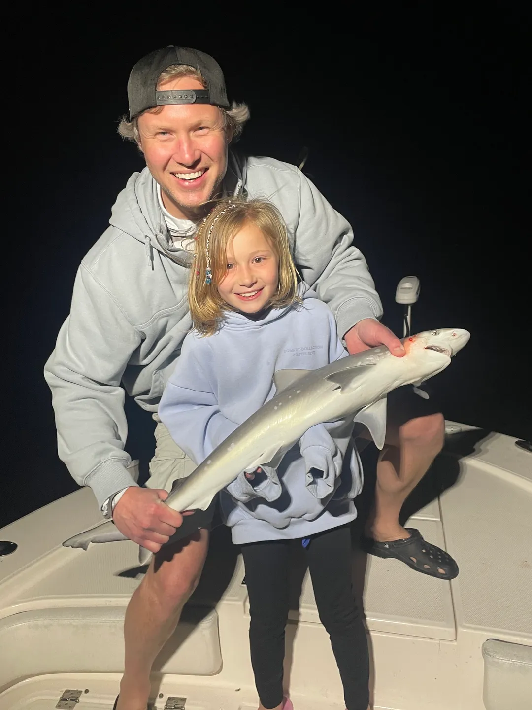 Smiling family with their fishing catch