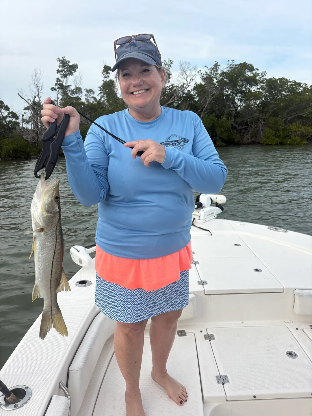Smiling angler with caught fish