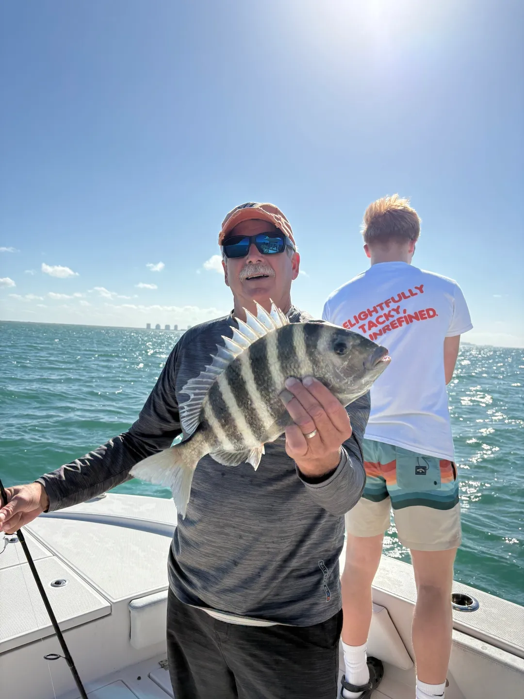 Man holding fish on a boat