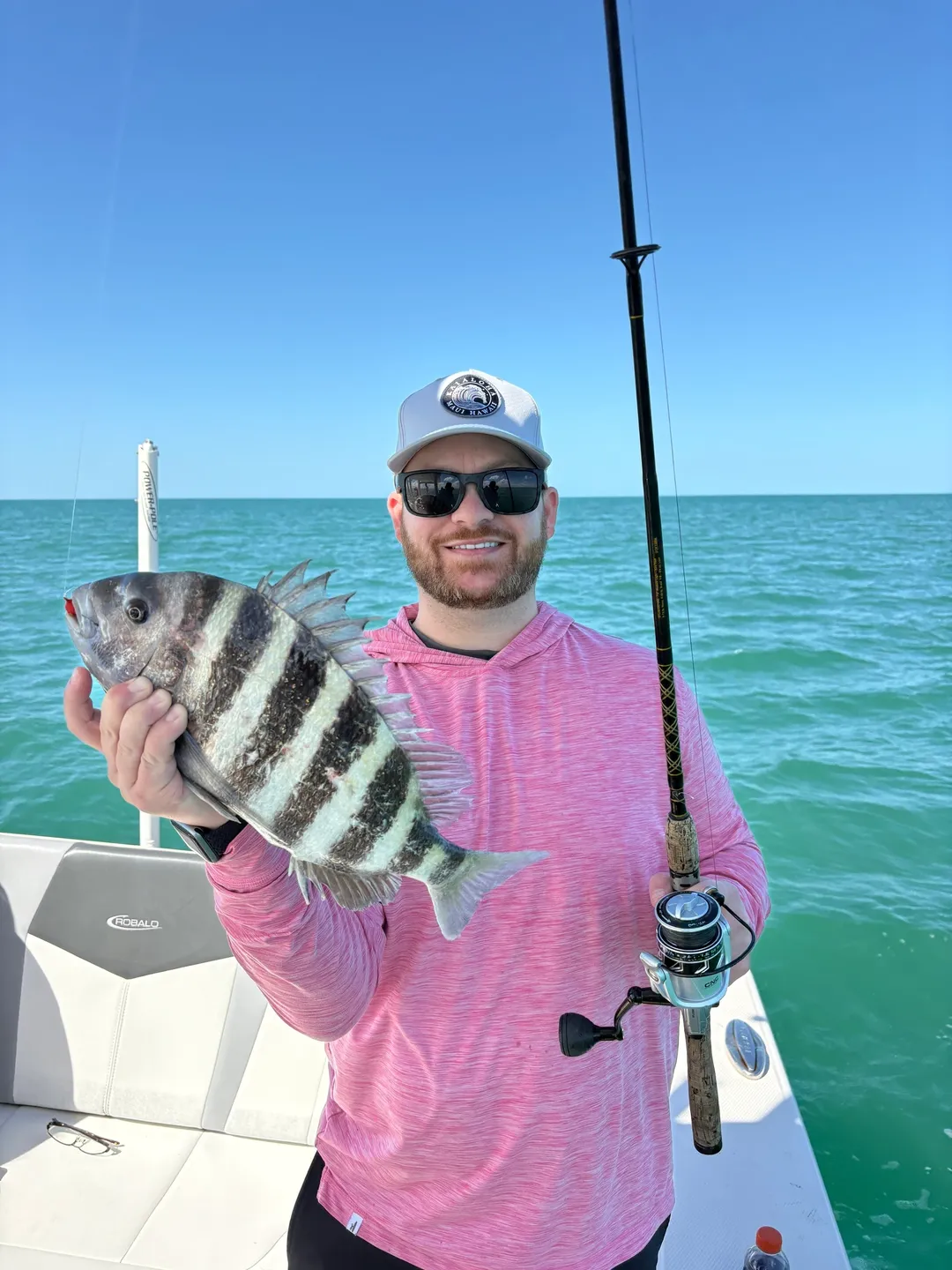 Man holding fish on a boat