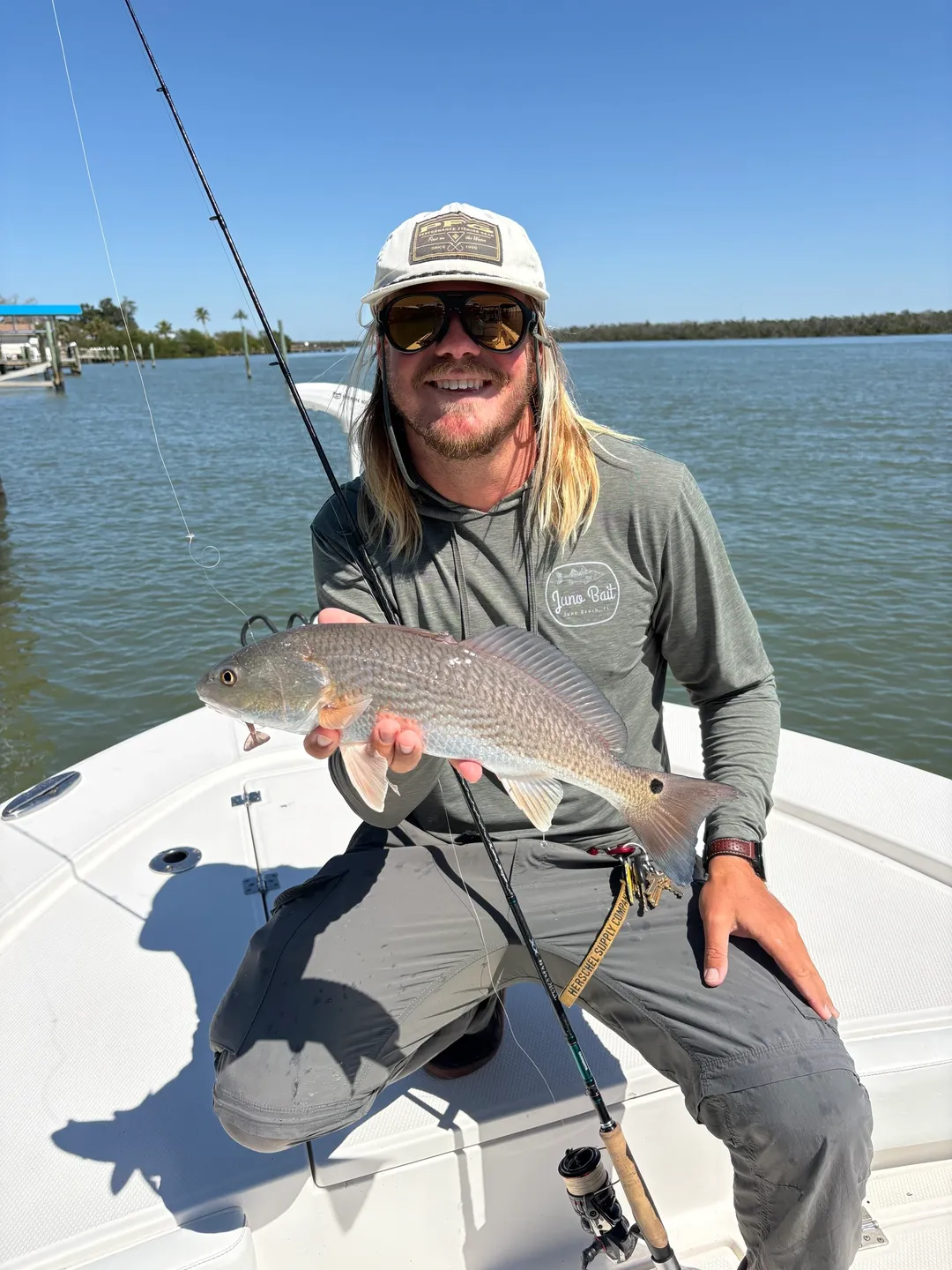 Man holding fish on a boat
